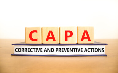 CAPA corrective and preventive actions symbol. Concept words CAPA corrective and preventive actions on cubes on a white background. Business CAPA corrective and preventive actions concept. Copy space.