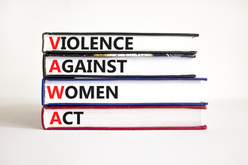VAWA violence against women act symbol. Concept words VAWA violence against women act on books....