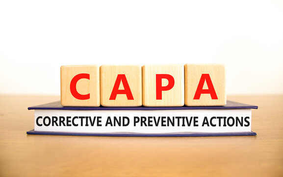 CAPA corrective and preventive actions symbol. Concept words CAPA corrective and preventive actions on cubes on a white background. Business CAPA corrective and preventive actions concept. Copy space.