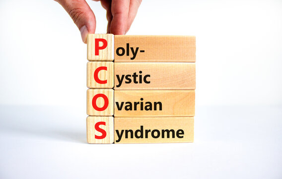 PCOS poly-cystic ovarian syndrome symbol. Concept words PCOS poly-cystic ovarian syndrome on blocks on a beautiful white background. Medical PCOS poly-cystic ovarian syndrome concept.