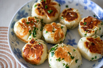 A plate of golden and tempting fresh pork fried buns