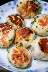 A plate of golden and tempting fresh pork fried buns