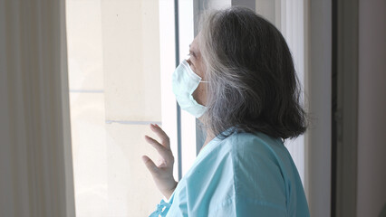 An Asian senior adult woman suffering from a mental disorder breakdown sickness, mental disorder concept, negative emotion, Alzheimer, depression and difficult life in the hospital situation concept