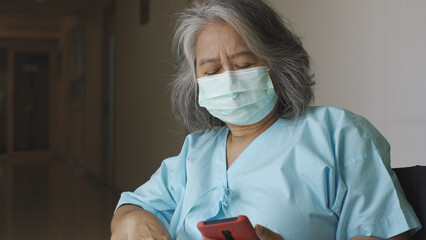 An Asian senior adult woman suffering from a mental disorder breakdown sickness, mental disorder...