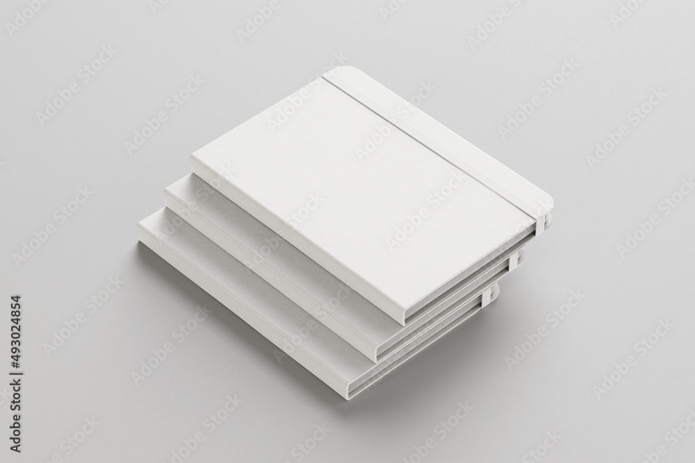 Poster stack of empty blank white books or notebooks mockup with textured cover isolated on grey background