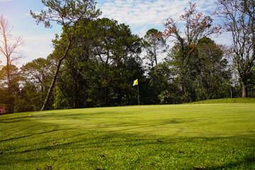 Golf course with a rich green turf beautiful scenery.