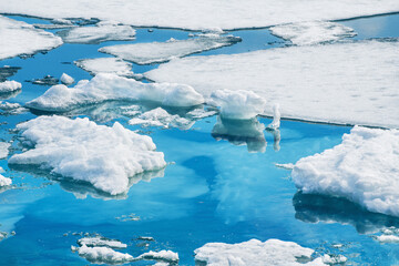 Melting ice floes on the coast of lake. Baikal lake, Siberia, Russia. Beautiful spring landscape....
