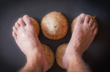 Traditional Thai massage by foot to the coconut shell or wisdom ancient people.