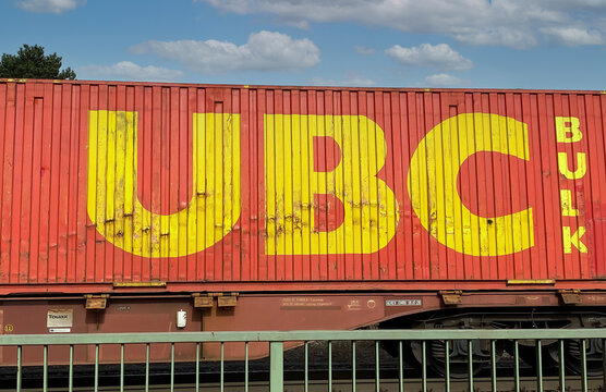 Viersen, Germany - March 9. 2022: View on freight train with cargo container of ubc united bulk carriers