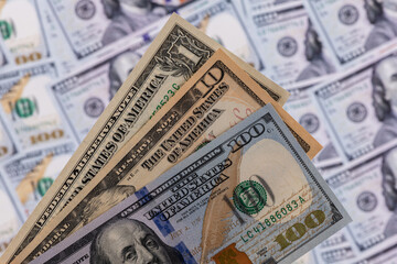 American banknotes in denominations of 1, 10 and 100 dollars