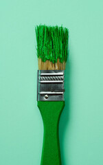 paintbrush with green paint