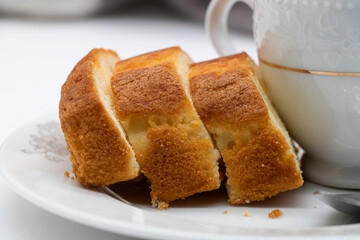 slices of baked pound cake over on white background