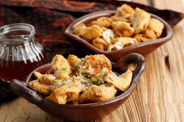 Tahu Gejrot is an Indonesian fried tofu in Sweet Spicy Sauce from Cirebon, West Java, Indonesia.