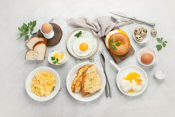 Various ways of cooking chicken eggs on light background.