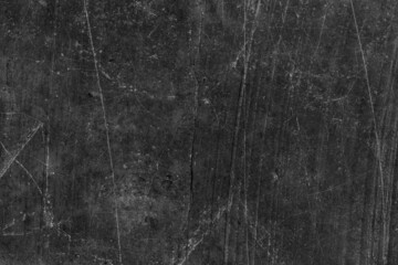 Old abandoned dark gray concrete wall surface with scratches and cracks for texture background
