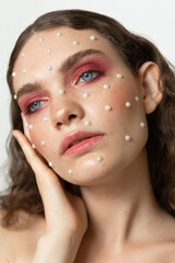 Beauty portrait of a beautiful girl with an unusual appearance, makeup in the studio.