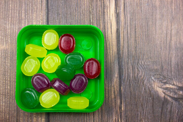 The Multi-colored lollipops. Lollipops close-up. Fruit lozenges. Natural caramel lozenges.