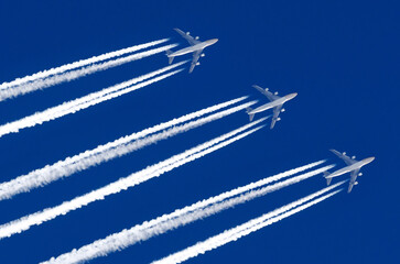 Airplane big four engines aviation airport contrail clouds.