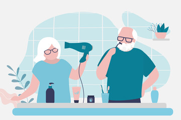 Grandparents doing morning routine together. Cute grandmother styling hair with hairdryer at bathroom