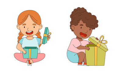 Happy little girls sitting on floor opening gift boxes cartoon vector illustration