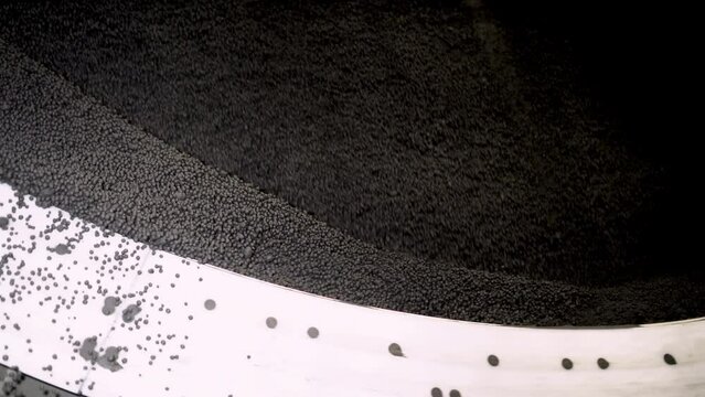 Production of iron ore pellets in pelletizer bowls. Part of the technological process for the processing of minerals. Raw material for metallurgy.