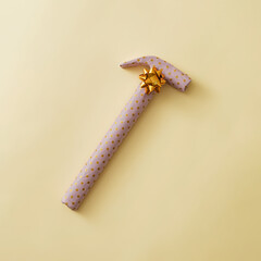 Gift wrapped hammer in yellow polka dot paper