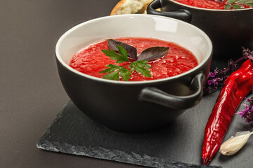 Spicy autumn tomato soup. Healthy hot food, garlic, chili, basil