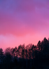 Fototapeta premium Beautiful cloudy sunset sky glowing violet and pink