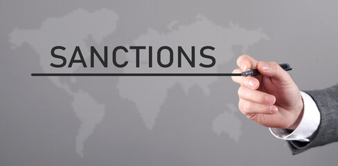 Man writes Sanction word in screen.