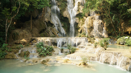 Fototapeta na wymiar Kuang Si Waterfall in tropical rainforest setting in Laos.