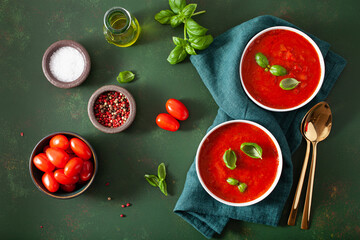 tomato and bell pepper vegetarian soup on green background