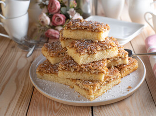 Cake platter with fresh baked caramelized almond sheet cake