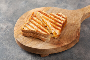 grilled cheese sandwich on gray concrete background