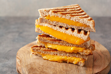 grilled cheese sandwich on gray concrete background