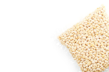 Pine nuts in a transparent vacuum package over