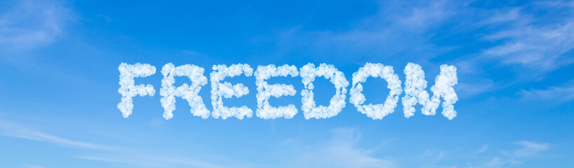 Freedom word made of clouds on blue sky background