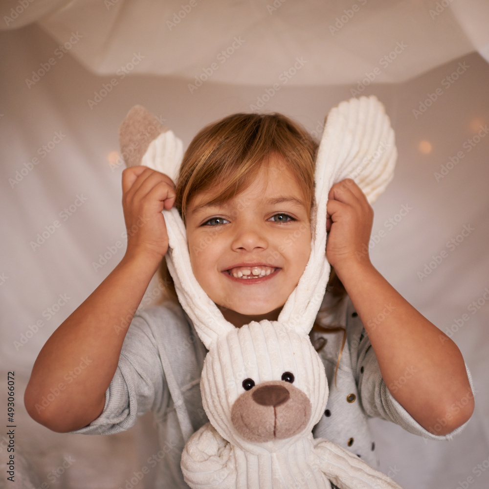 Canvas Prints My funny bunny. Portrait of an adorable little girl playfully holding her toy rabbit.