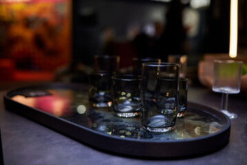 Black designer glasses on a black table