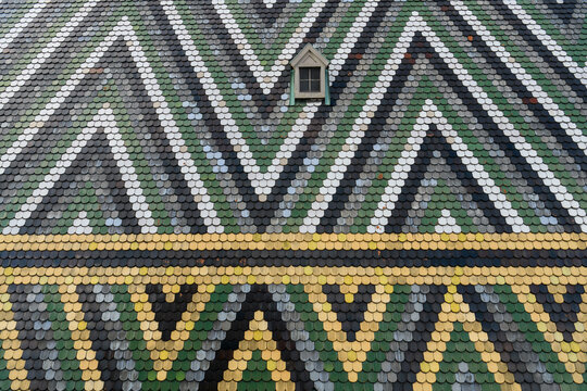 Fragment of a patterned tiled roof of St. Stephen's Cathedral Stephansdom in Vienna, Austria. January 2022