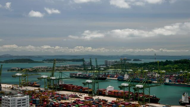 Time lapse of the bustling Singapore port in bright sunshine