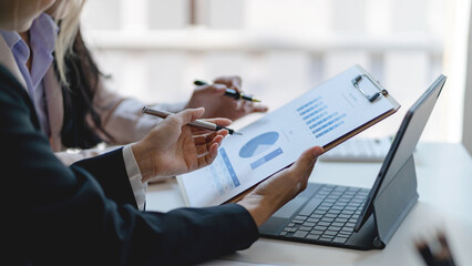 Two businesswoman discuss investment project working and business planning strategy at office.