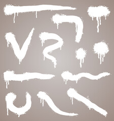  spray paint shapes in white. Graffiti stencil template or paint streaks. Abstract lines and drips. Splashes for your design