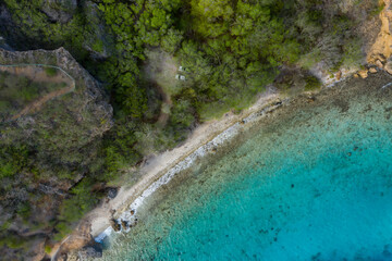 Aerial view of the coast of Curaçao in the Caribbean with beach, cliff, and turquoise ocean