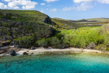 Aerial view of the coast of Curaçao in the Caribbean with beach, cliff, and turquoise ocean