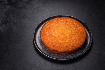 Pumpkin pie on marble cutting board. Dark background. Copy space