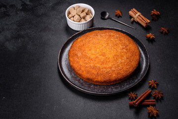 Pumpkin pie on marble cutting board. Dark background. Copy space