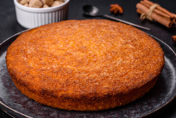 Pumpkin pie on marble cutting board. Dark background. Copy space