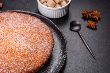 Pumpkin pie on marble cutting board. Dark background. Copy space