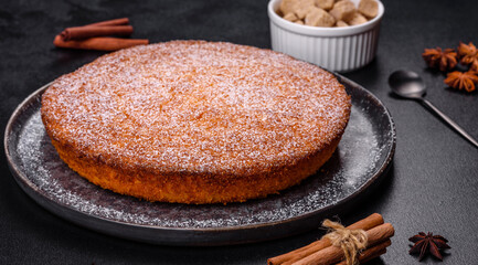 Pumpkin pie on marble cutting board. Dark background. Copy space