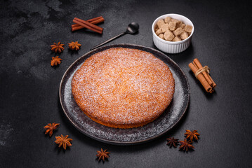 Pumpkin pie on marble cutting board. Dark background. Copy space